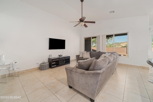 living room with light tile patterned floors, ceiling fan, and high vaulted ceiling