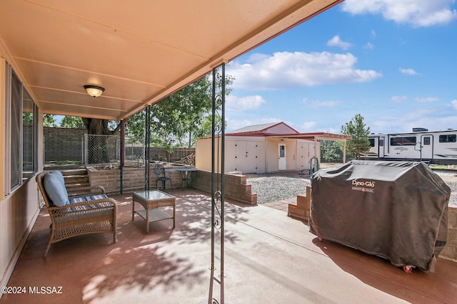 view of patio featuring grilling area and fence