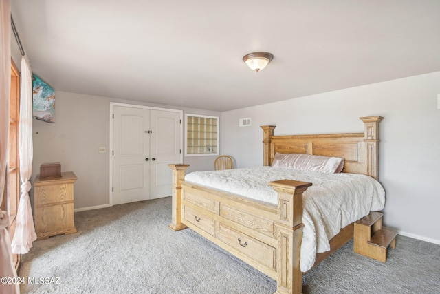 bedroom featuring light colored carpet, visible vents, and baseboards