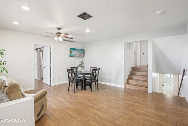 dining room with stairs, a ceiling fan, visible vents, light wood-style floors, and recessed lighting