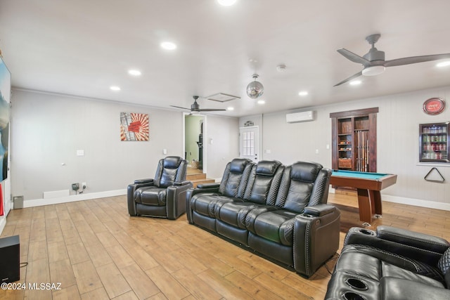 home theater room with billiards, a wall unit AC, light wood-style flooring, and a ceiling fan