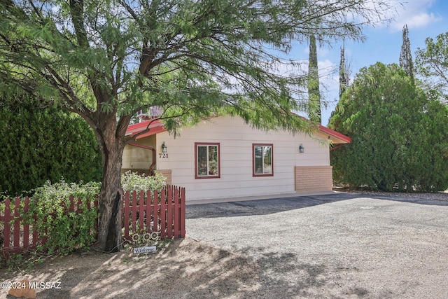 view of property exterior with fence