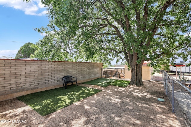 view of yard with a fenced backyard