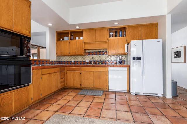 kitchen with black appliances, tasteful backsplash, open shelves, and brown cabinetry