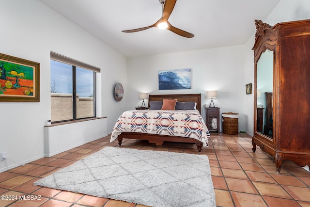 bedroom featuring baseboards, a ceiling fan, and tile patterned floors