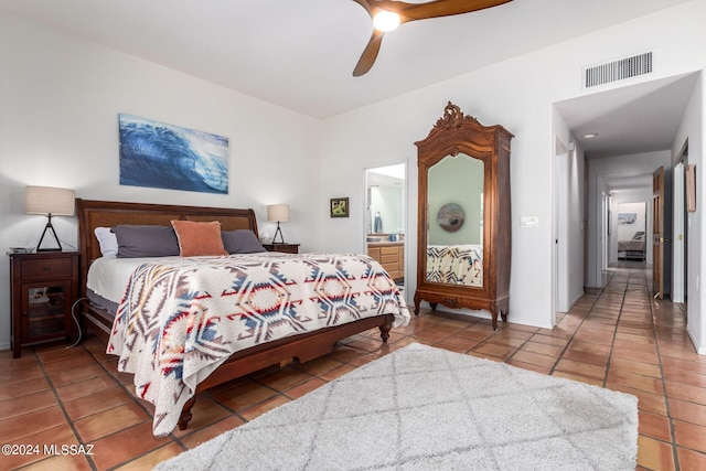 bedroom featuring ceiling fan, visible vents, connected bathroom, and tile patterned floors