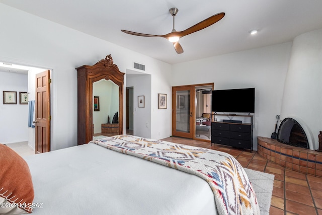 bedroom with light tile patterned floors, ceiling fan, and visible vents