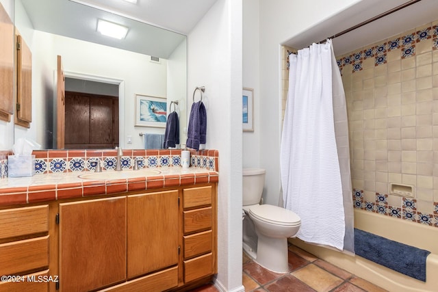 bathroom with tile patterned flooring, toilet, visible vents, vanity, and shower / bath combo with shower curtain