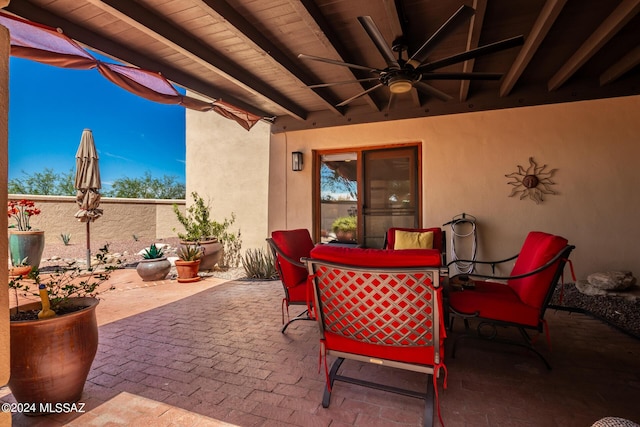 view of patio / terrace featuring outdoor dining space and ceiling fan