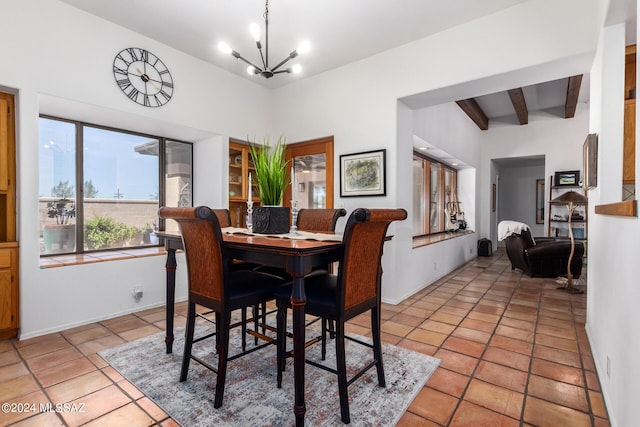 dining area with a notable chandelier, beamed ceiling, and light tile patterned floors