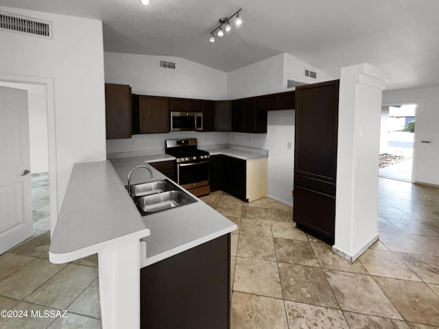 kitchen with a sink, visible vents, stainless steel appliances, and light countertops