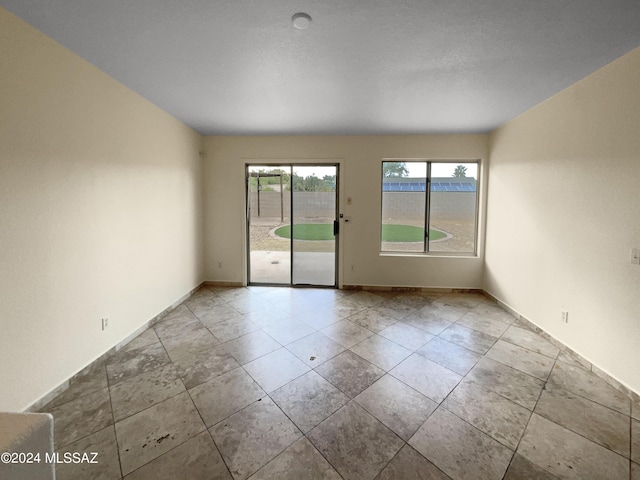 empty room with baseboards