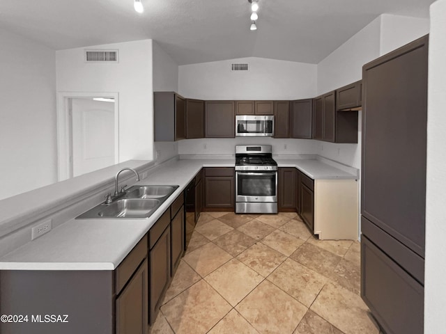 kitchen with stainless steel appliances, light countertops, visible vents, and a sink