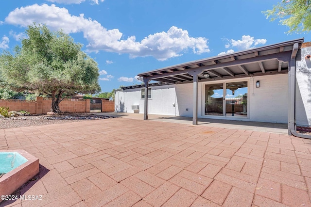 view of patio / terrace featuring fence