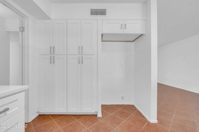 walk in closet with light tile patterned flooring and visible vents