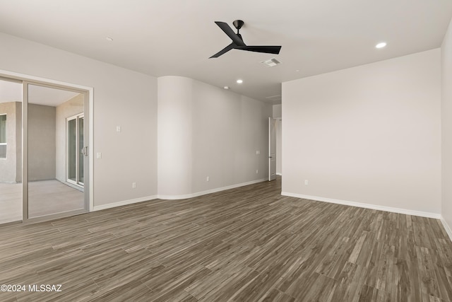 empty room featuring dark hardwood / wood-style floors and ceiling fan