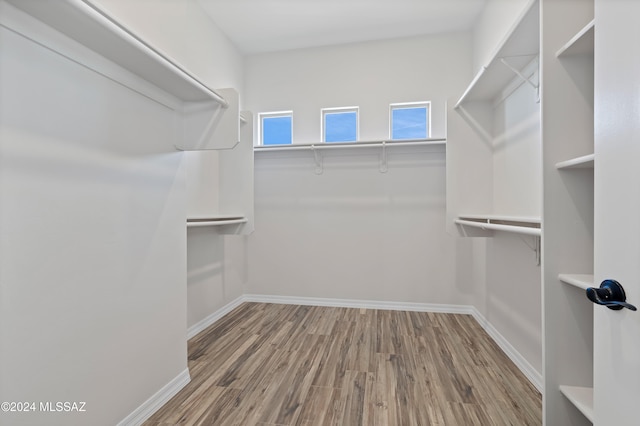 walk in closet featuring hardwood / wood-style floors