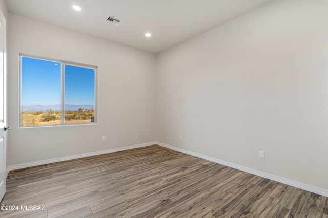 spare room featuring light wood-type flooring