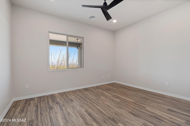 unfurnished room featuring hardwood / wood-style flooring and ceiling fan