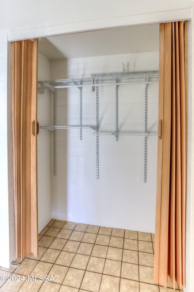 walk in closet featuring light tile patterned floors