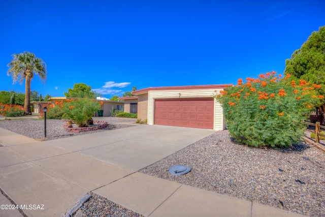 ranch-style house featuring a garage