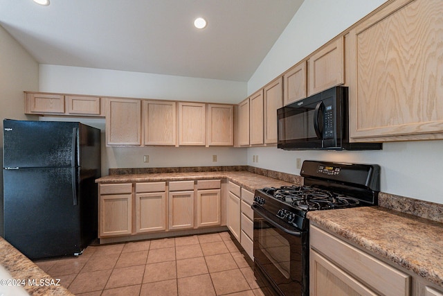 kitchen with lofted ceiling, black appliances, light brown cabinetry, and light tile patterned floors