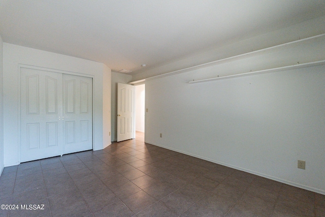 unfurnished bedroom featuring a closet