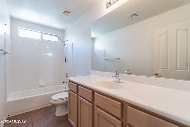 full bathroom featuring vanity, toilet, tile patterned floors, and bathing tub / shower combination