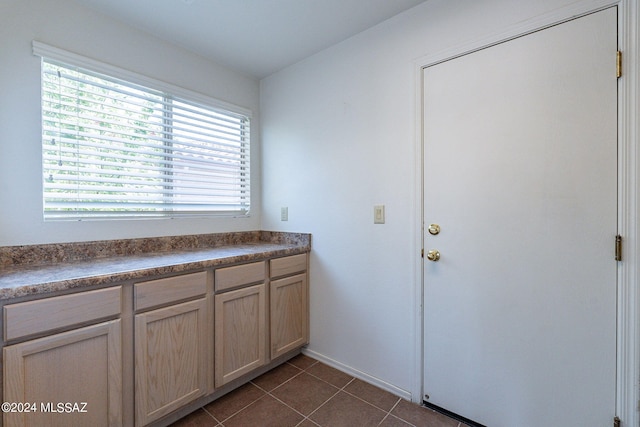 interior space with tile patterned floors and plenty of natural light