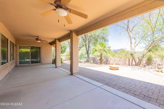 view of patio / terrace featuring fence and ceiling fan