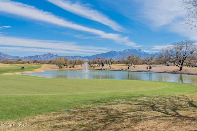 view of home's community featuring a lawn and a water and mountain view