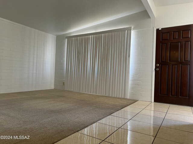 view of carpeted foyer