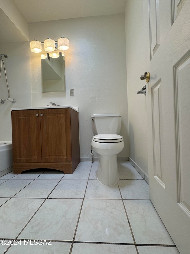 bathroom with a tub, tile patterned flooring, toilet, and vanity