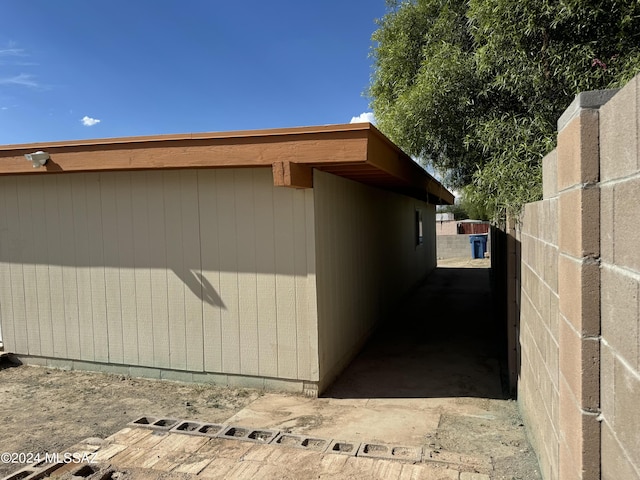 view of side of property with fence