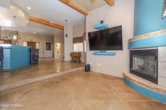 unfurnished living room featuring beamed ceiling