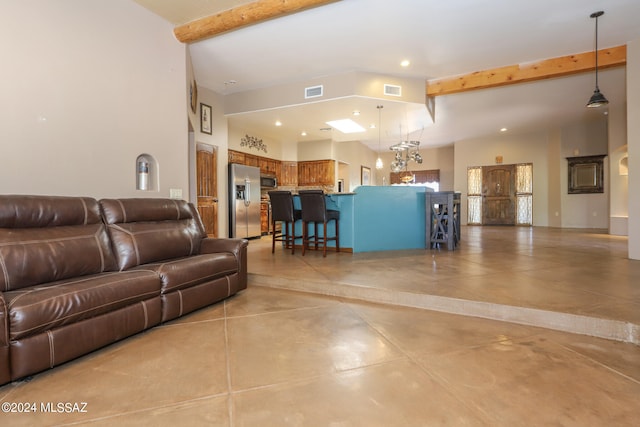 living room featuring a high ceiling and beamed ceiling