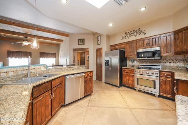 kitchen featuring backsplash, stainless steel appliances, sink, ceiling fan, and beam ceiling