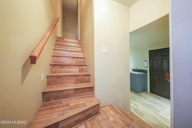 staircase featuring hardwood / wood-style floors