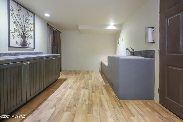 interior space with sink and light hardwood / wood-style floors