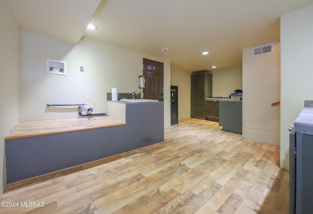 kitchen with sink and light wood-type flooring