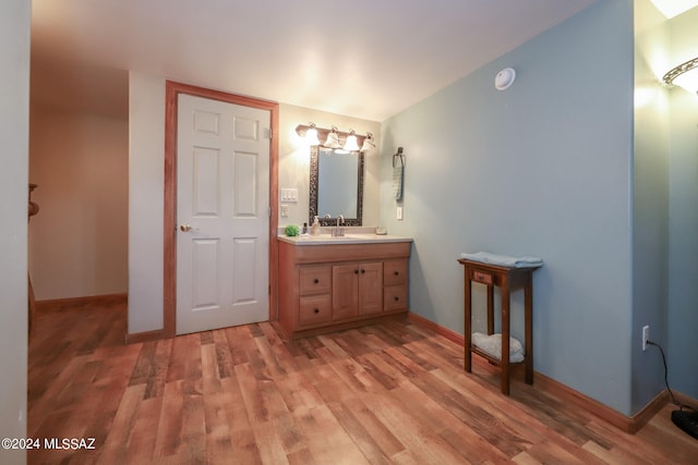 bathroom with vanity and hardwood / wood-style floors