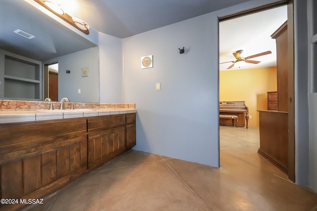 bathroom with vanity, concrete floors, and ceiling fan