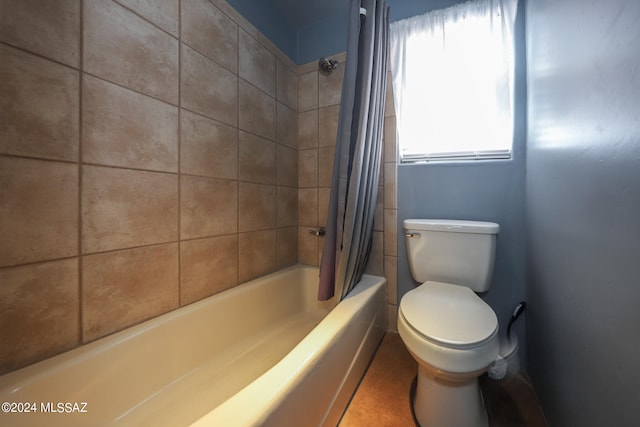 bathroom with toilet and shower / bathtub combination with curtain