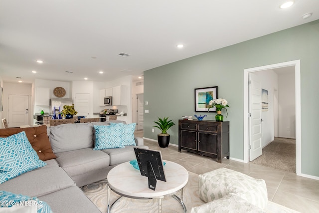 living room featuring light carpet