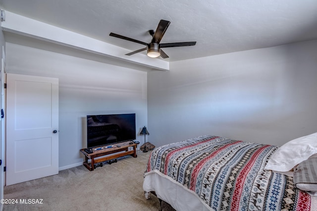 bedroom with light colored carpet and a ceiling fan