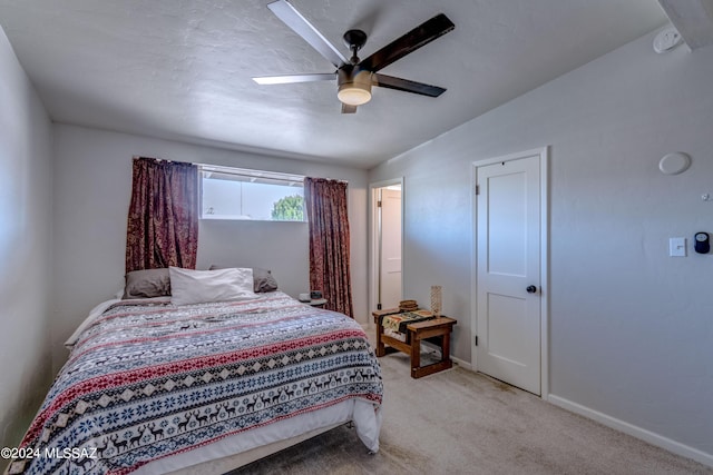 bedroom with carpet, baseboards, and ceiling fan