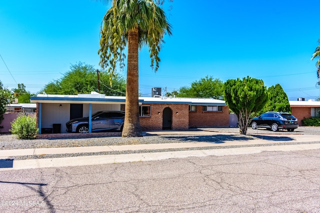 ranch-style home with a carport