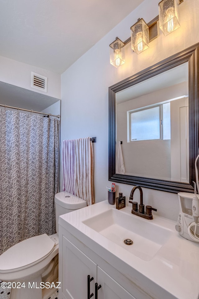 full bathroom with visible vents, toilet, and vanity