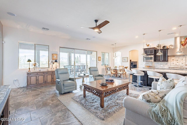 living room featuring ceiling fan