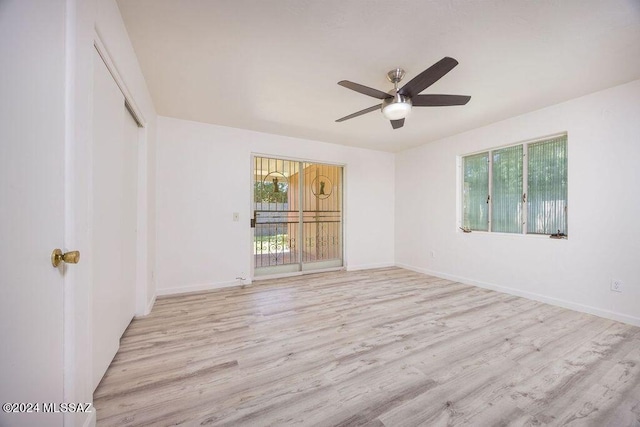 unfurnished room featuring ceiling fan and light hardwood / wood-style floors